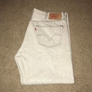 White, stylish jeans with gray stitching.